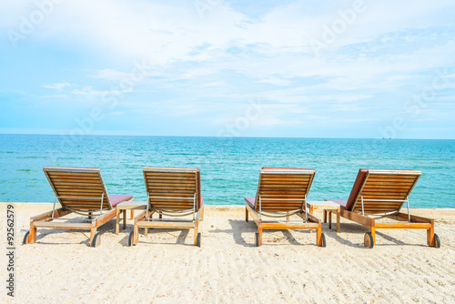 Umbrella and chair on beautiful tropical beach © siraphol