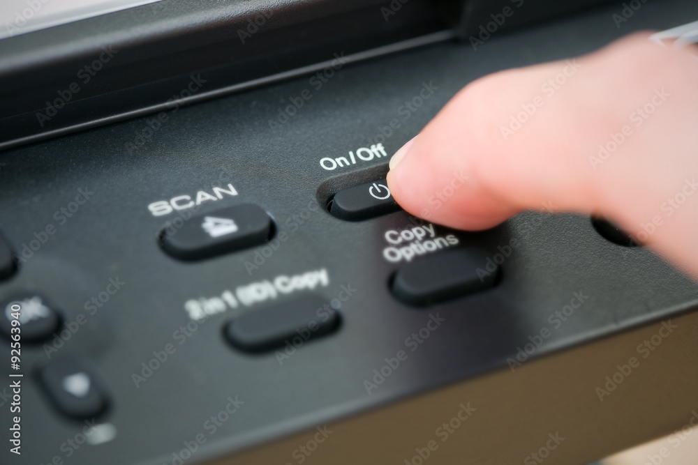 Close-up hand button open the photocopier. Close-up hand button open the photocopier.