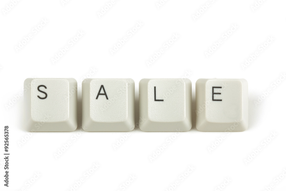 sale from scattered keyboard keys on white sale from scattered keyboard keys on white