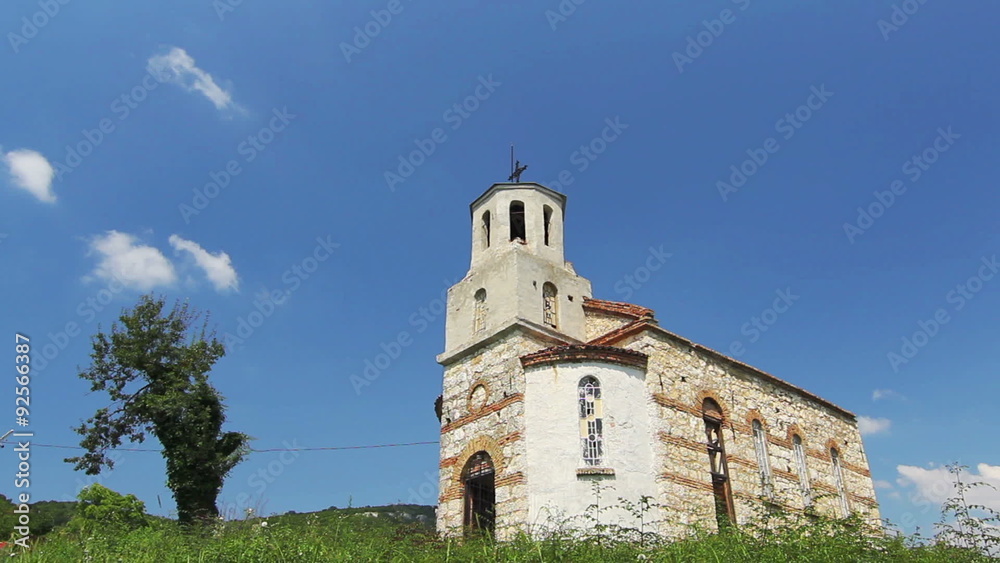 Old church with moving clouds time lapse and blue sky background Old church with moving clouds time lapse and blue sky background