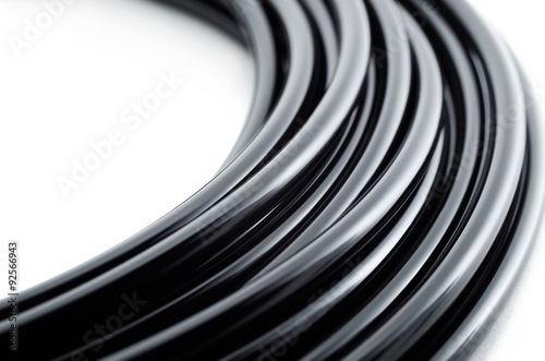 Black wire bundle macro photo with white background