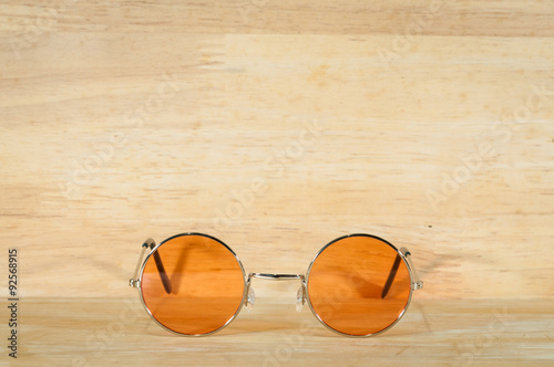 retro sunglasses on wooden texture