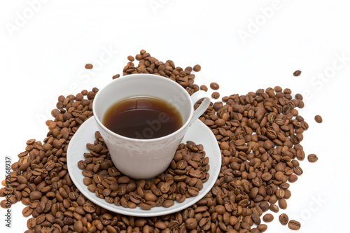 Coffee beans in coffee cup isolated on white