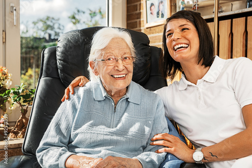Nurse caring for elderly person photo