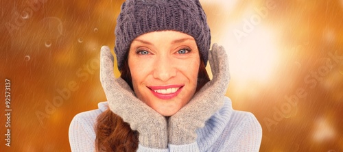 Composite image of pretty redhead in warm clothing