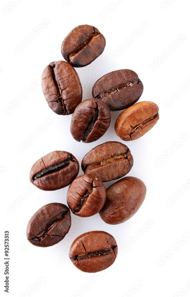 Brown coffee beans isolated on white Brown coffee beans isolated on white