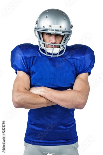 Portrait of American football player with arms crossed