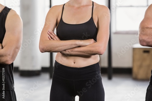 Midsection of a woman with arms crossed