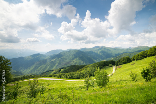 Mountanis landscape against blue sky with clouds