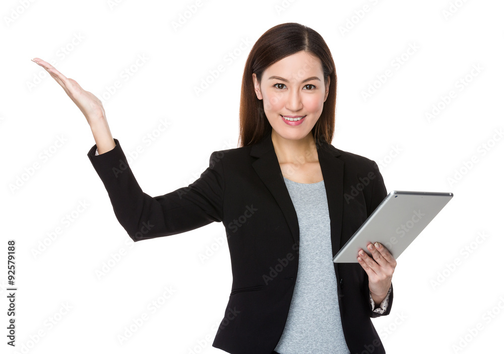 Businesswoman use of the tablet pc and open hand palm Businesswoman use of the tablet pc and open hand palm