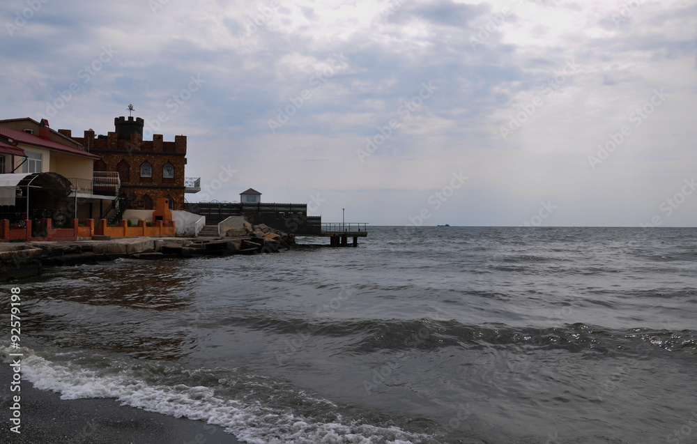 Fototapeta premium Summer house on the sea coast in the evening