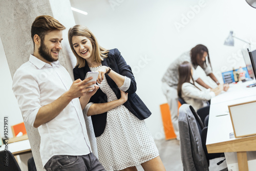 Colleagues talkin in an office environment photo