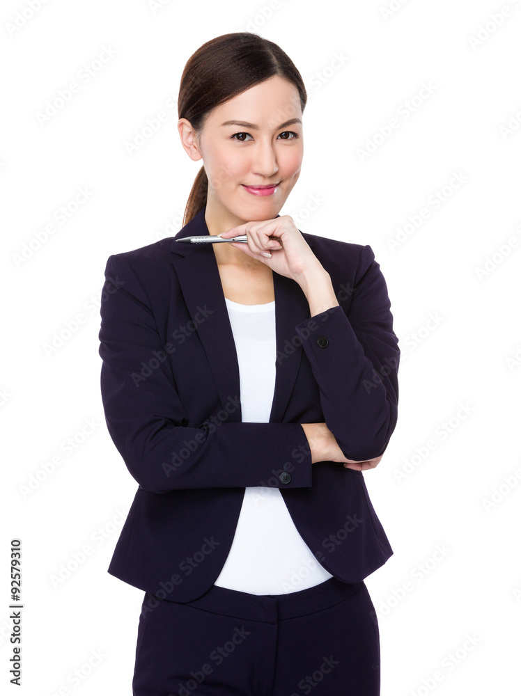 Asian Businesswoman think of idea with a pen Asian Businesswoman think of idea with a pen
