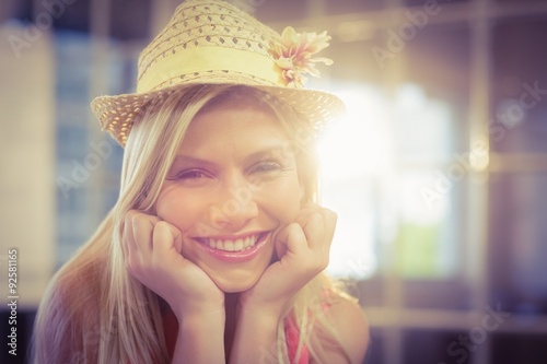 Portrait of happy businesswoman wearing hat