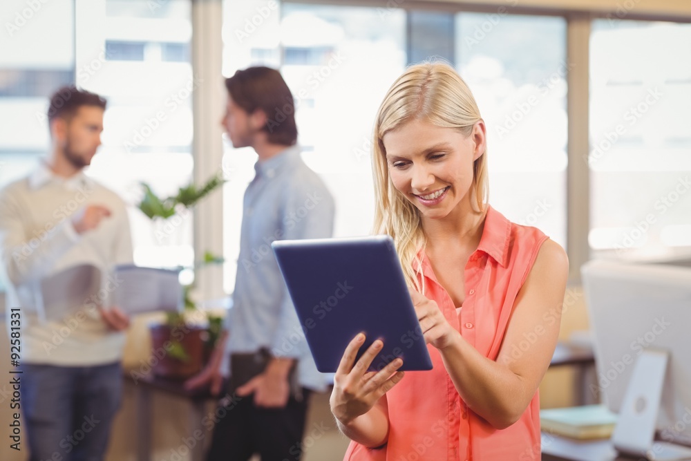 Smiling businesswoman using digital PC in office Smiling businesswoman using digital PC in office
