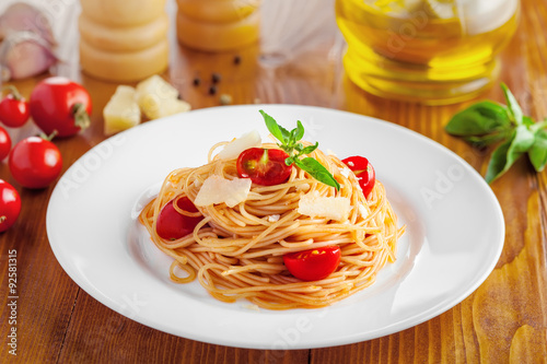 Pasta in tomato sauce with parmesan cheese and basil