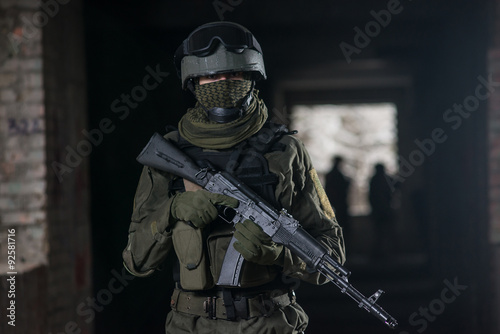 Fully equipped military men with automatic weapons playing © nik40fox