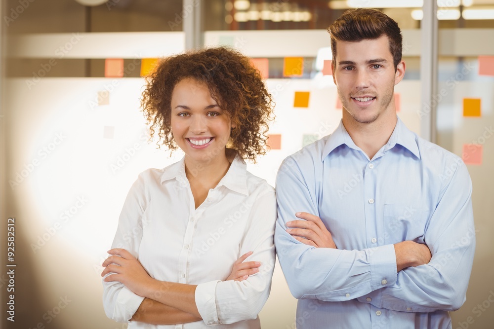 Business people standing with arms crossed Business people standing with arms crossed