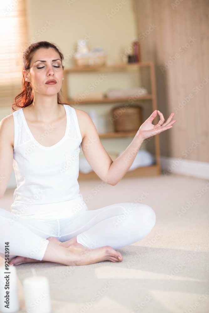 Full length of woman in yoga pose with eyes closed