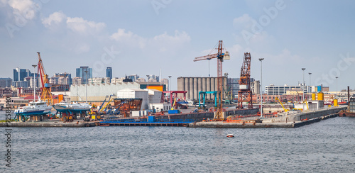 Fototapeta Port of Naples, coastal cityscape with shipyard