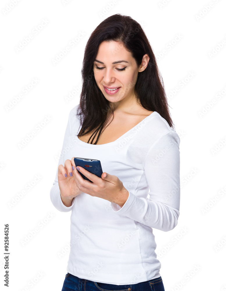 Brunette woman read on the mobile phone Brunette woman read on the mobile phone