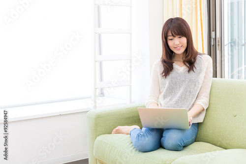 young asian woman using laptop