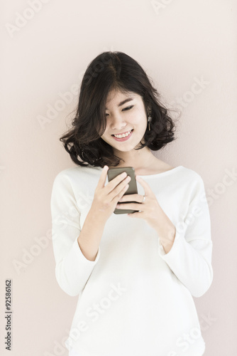 asian woman hold mobile