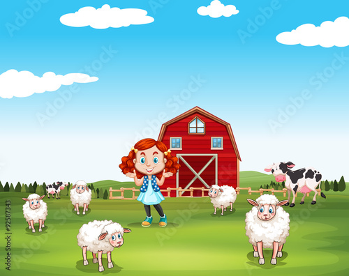 Little girl and sheeps at the farm