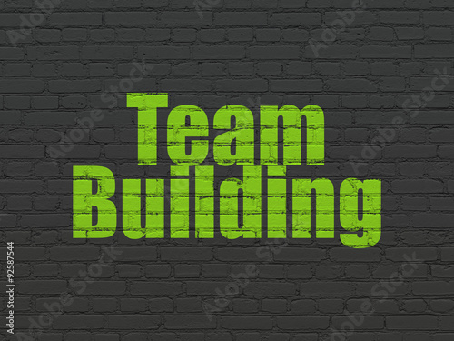 Business concept: Team Building on wall background