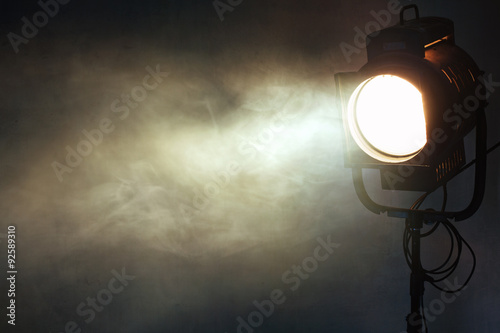theater spot light with smoke against grunge wall Fototapet
