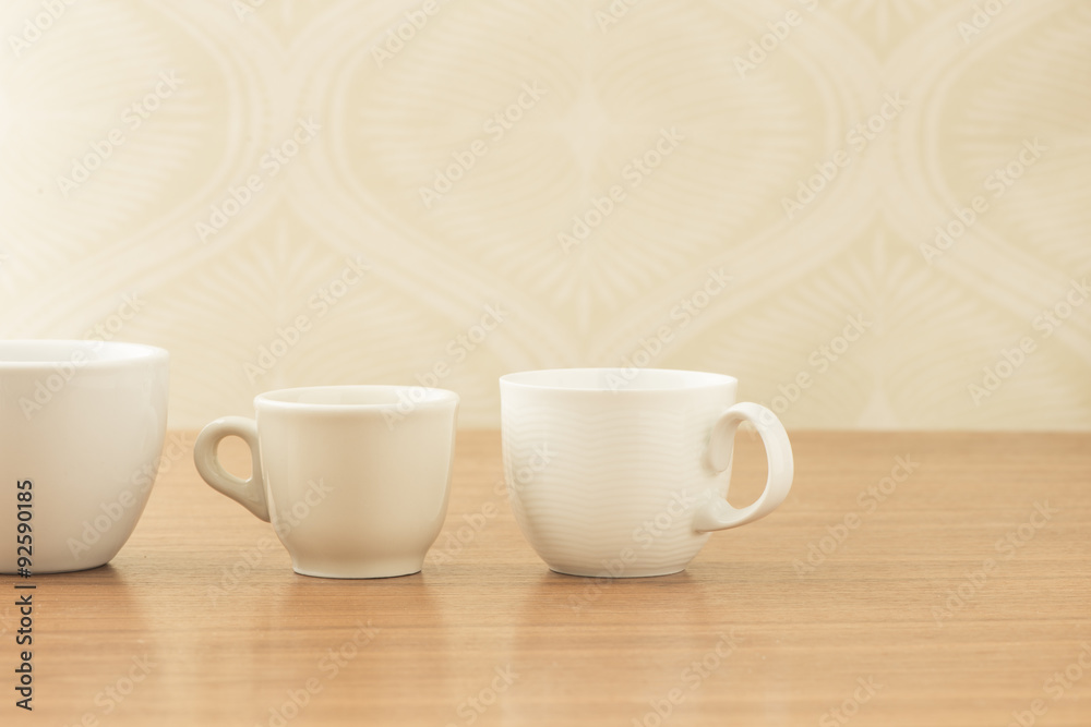 Empty coffee cups on wooden table Empty coffee cups on wooden table