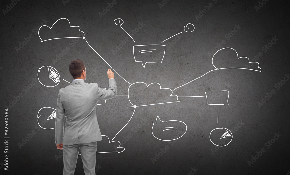 businessman drawing cloud computing scheme