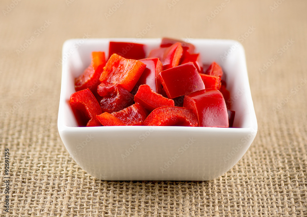 Delicious organic diced capsicum on burlap background Delicious organic diced capsicum on burlap background