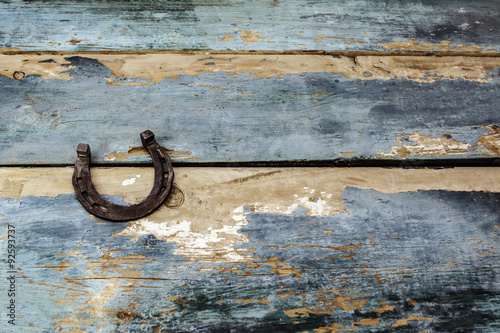 old horseshoe on a wooden background