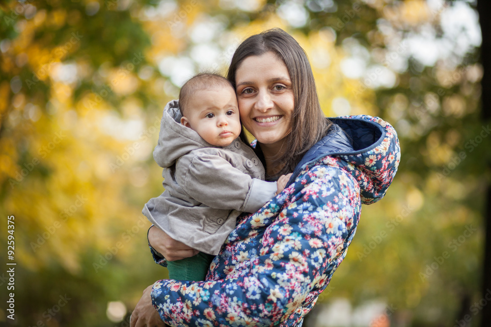 Mother and her child enjoy the early autumn Mother and her child enjoy the early autumn