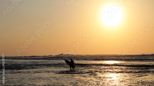 Fototapeta Naklejka Na Ścianę i Meble -  Surfing in Bali at sunset