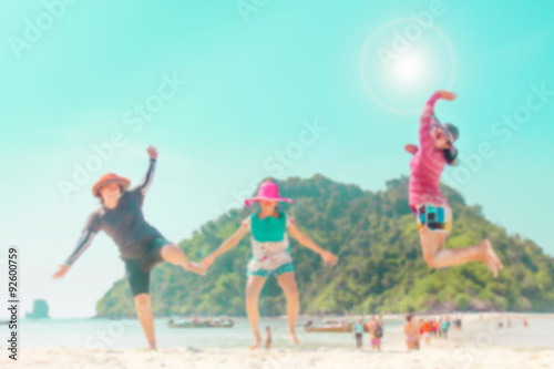 Blurred group of friend happy with jumping on the beach : Holiday or summer concept