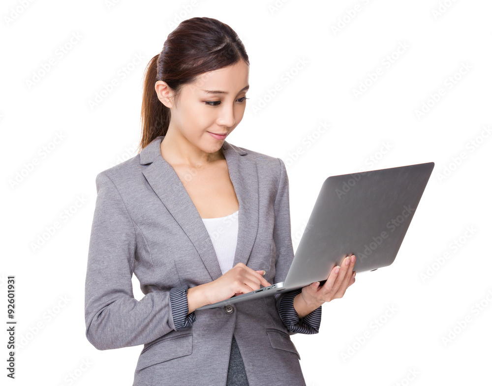 Asian businesswoman read on the notebook computer Asian businesswoman read on the notebook computer