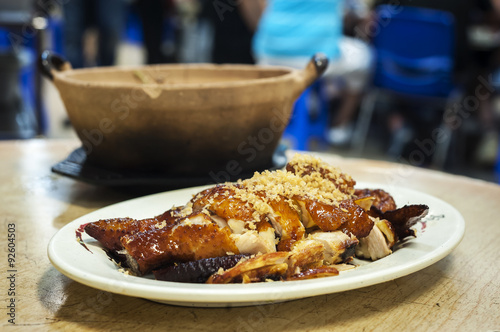 Classic roasted chicken topped with garlic served at a Hong Kong restaurant photo