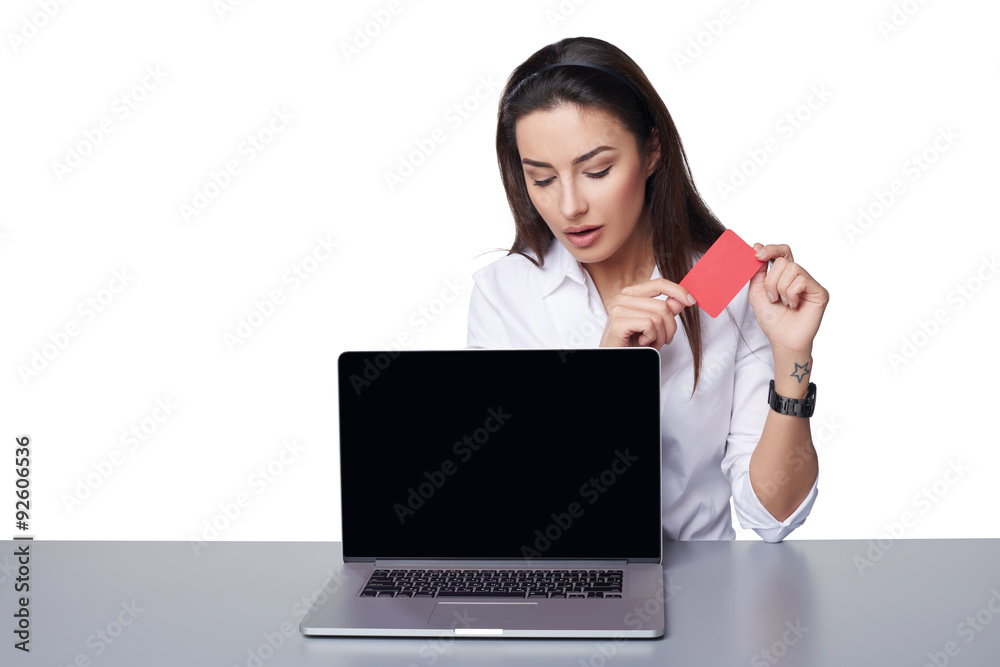 Business woman with laptop showing credit card Business woman with laptop showing credit card