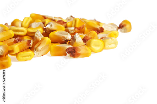 Heap of dried corn kernels, isolated on white background