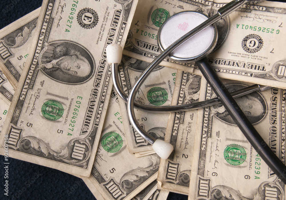 The health costs: a stetoscopio supported on the dollars The health costs: a stetoscopio supported on the dollars