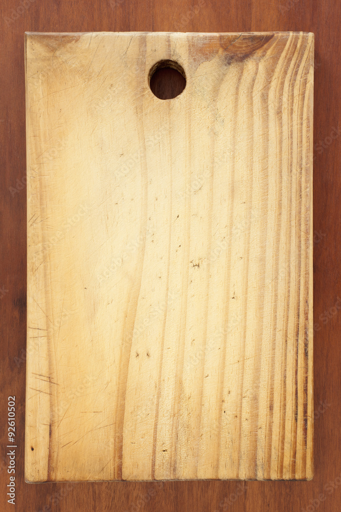 Mama Cutting board! Top view of wooden cutting board over kitchen table. Mama Cutting board! Top view of wooden cutting board over kitchen table.