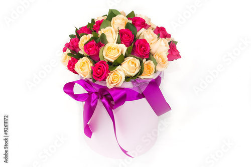 deluxe bucket of red and yellow roses on white background