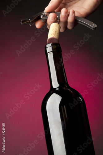 Bottle and wine glass photo