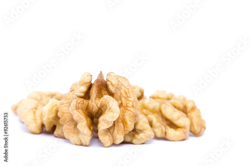 Small group of walnuts on a white background.