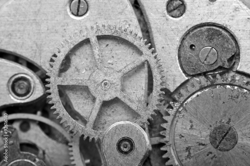 Black-and-white Metal Cogwheels in Oldest Clockwork, Macro.