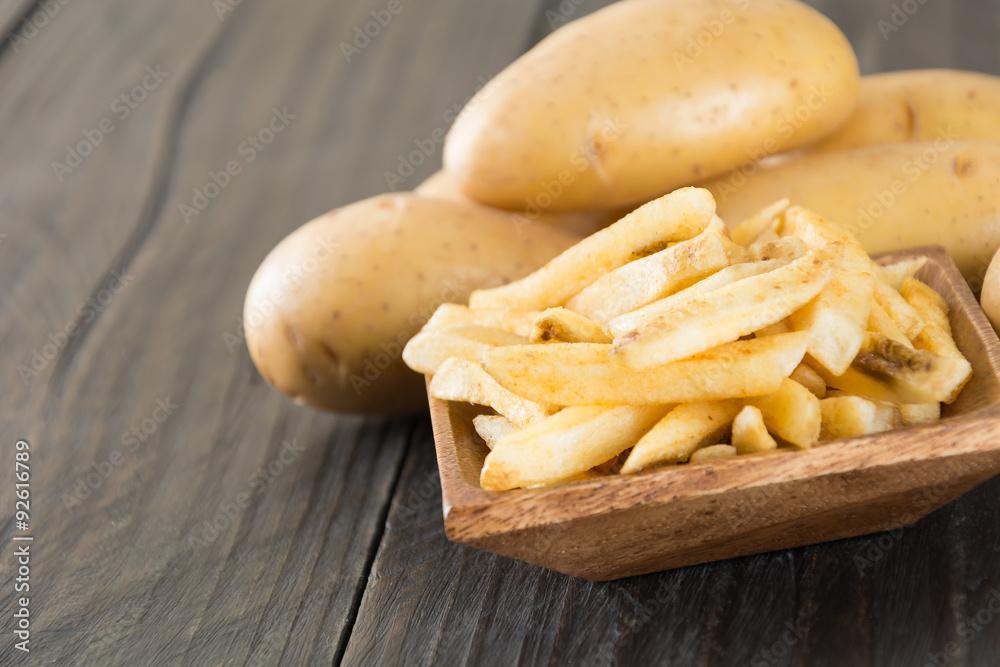 french fries on wood background french fries on wood background