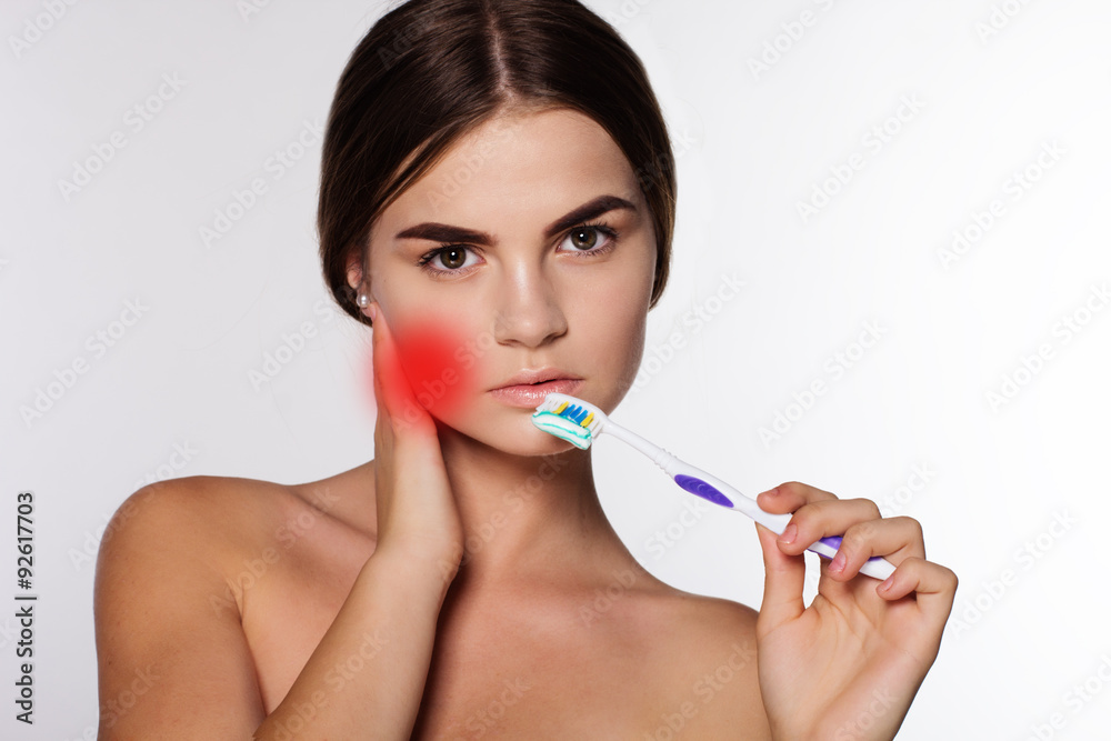 Young girl is getting toothache isolated on white Young girl is getting toothache isolated on white