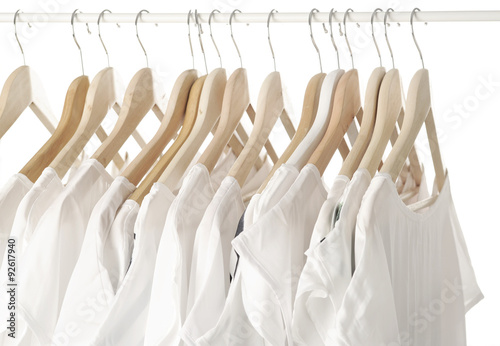 white clothes on hangers close up